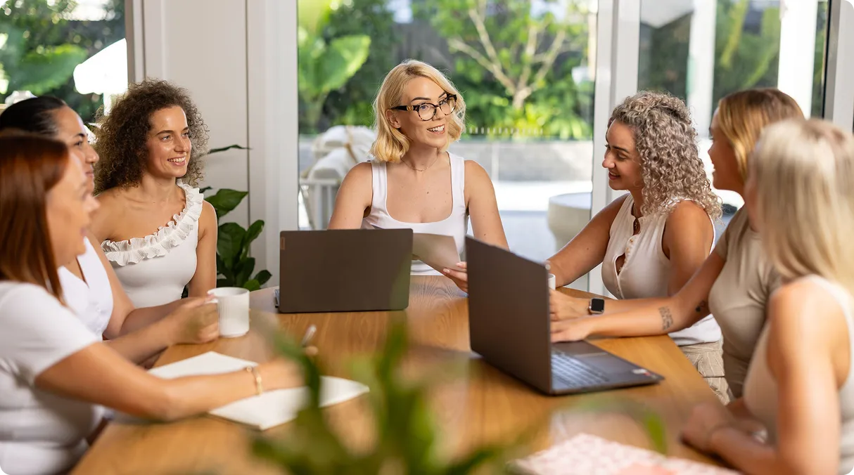 The Andromedae team in discussion around a meeting table